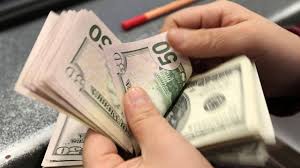 Hərracda dollar ucuzlaşdı